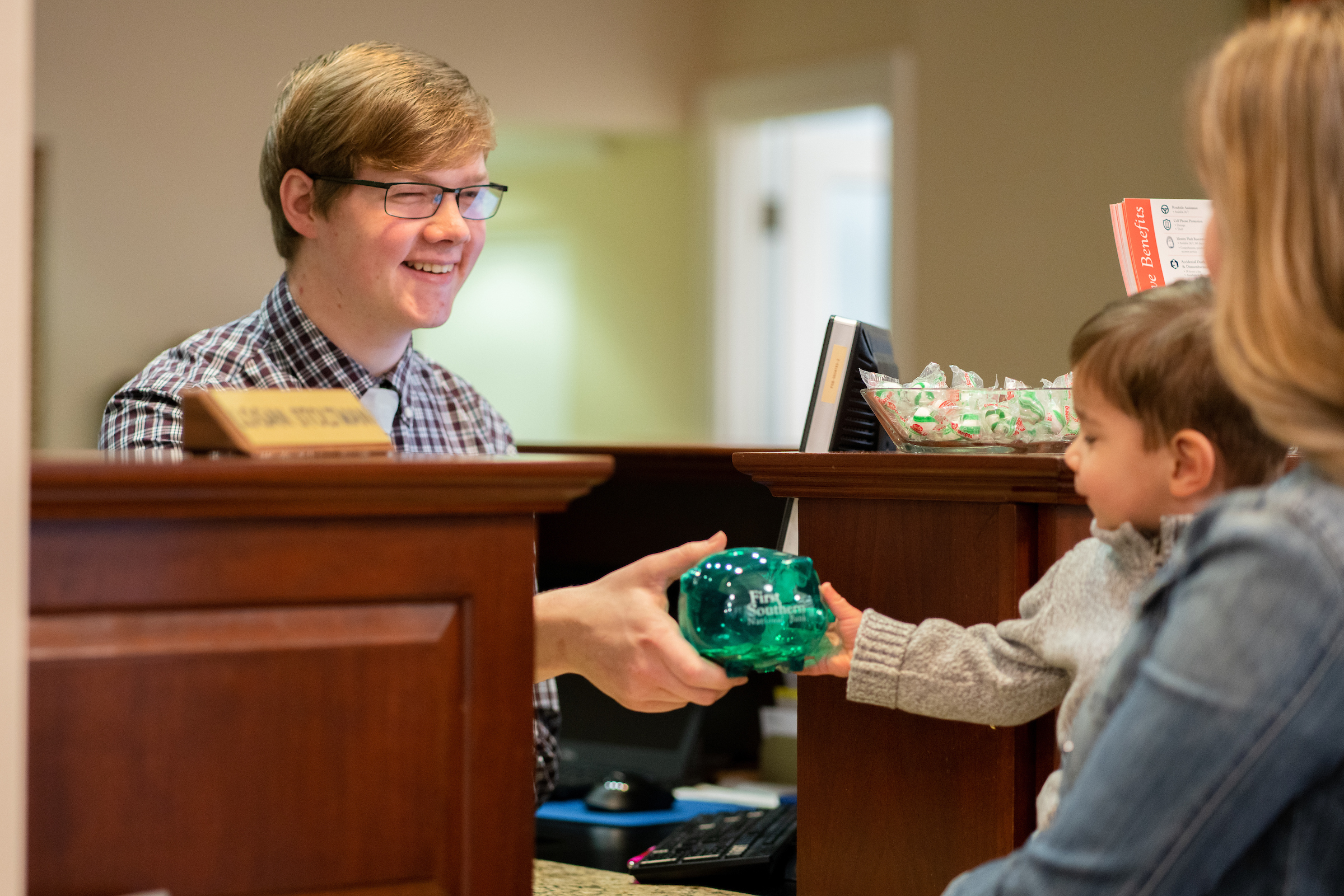 Logan Stoltman helps a customer at First Southern National Bank. Digital Marketing, Website Design, Branding, Graphic Design, Logo Design, Advertising, and Marketing Agency services in Danville, Kentucky.