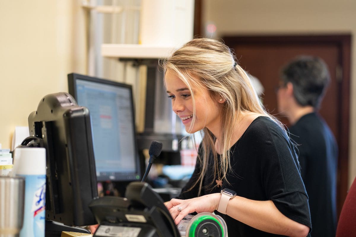 Teller at First Southern National Bank completes a transaction. Digital Marketing, Website Design, Branding, Graphic Design, Logo Design, Advertising, and Marketing Agency services in Danville, Kentucky.